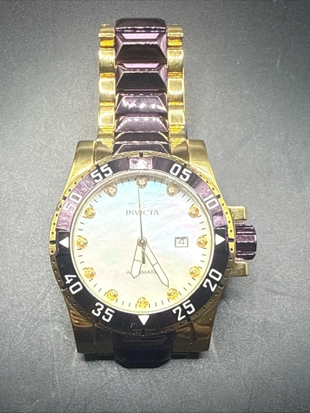 Invicta Excursion model 33349 MOP Dial Purple Gold Tone